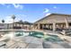 A sparkling backyard pool and spa with lounge chairs and covered patio at 19903 E Augustus Ave, Queen Creek, AZ 85142