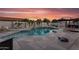 Backyard pool with inviting lounge area, lush landscaping, and a relaxing patio space for outdoor entertainment at 19903 E Augustus Ave, Queen Creek, AZ 85142