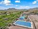 Aerial view showcasing the community recreation center with mountain views in the background at 20453 W Daniel Pl, Buckeye, AZ 85396