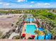 Stunning aerial view of community pool complex with lap pool, recreational pool, and splash pad at 20453 W Daniel Pl, Buckeye, AZ 85396