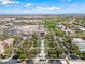 Expansive aerial view showcasing the community, pool, and surrounding cityscape under a bright, blue sky at 20453 W Daniel Pl, Buckeye, AZ 85396