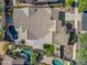 Aerial view of a private backyard featuring a sparkling pool, lush landscaping, and outdoor seating at 20453 W Daniel Pl, Buckeye, AZ 85396