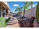 The backyard oasis includes a lagoon-style pool, mature landscaping and lounge chairs at 20453 W Daniel Pl, Buckeye, AZ 85396