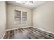 Bedroom with wood floors, neutral paint and views of the outdoor space at 20453 W Daniel Pl, Buckeye, AZ 85396