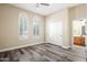 Inviting bedroom with natural light and shuttered windows, leading to en-suite bathroom at 20453 W Daniel Pl, Buckeye, AZ 85396