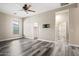 Bright bedroom with a ceiling fan, adjacent to a walk-in closet at 20453 W Daniel Pl, Buckeye, AZ 85396