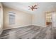 Bedroom with natural light, hardwood floors and ensuite bathroom perfect for unwinding after a long day at 20453 W Daniel Pl, Buckeye, AZ 85396