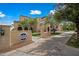 Community clubhouse exterior view featuring beautiful architecture, landscaping, and ample parking for residents at 20453 W Daniel Pl, Buckeye, AZ 85396