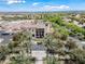 Aerial view of the community clubhouse with landscaped grounds, pool, and surrounding residential areas at 20453 W Daniel Pl, Buckeye, AZ 85396
