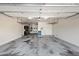 Spacious two car garage providing ample parking and storage opportunities, with a clean epoxy floor at 20453 W Daniel Pl, Buckeye, AZ 85396