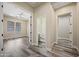 Hallway leading to bedrooms and bathrooms, with hardwood floors and bright lighting at 20453 W Daniel Pl, Buckeye, AZ 85396