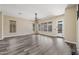Bright living room featuring wood floors, neutral paint, and a ceiling fan at 20453 W Daniel Pl, Buckeye, AZ 85396