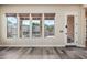 Bright living room with beautiful windows looking into backyard and stylish flooring at 20453 W Daniel Pl, Buckeye, AZ 85396