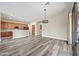 Open living room with wood floors and direct access to kitchen at 20453 W Daniel Pl, Buckeye, AZ 85396