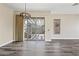 Bright living room with wood floors and slider doors leading to the backyard at 20453 W Daniel Pl, Buckeye, AZ 85396