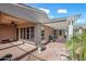 The large covered patio includes a ceiling fan and barbecue at 20453 W Daniel Pl, Buckeye, AZ 85396