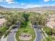 Scenic street view featuring lush landscaping and palm trees creating a welcoming and picturesque environment at 20453 W Daniel Pl, Buckeye, AZ 85396