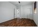 Bedroom with wood flooring, closet, and access to the kitchen, providing convenient living at 21582 W Cocopah St, Buckeye, AZ 85326