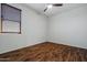 Bright bedroom with wood flooring and window, offering a serene and well-lit space at 21582 W Cocopah St, Buckeye, AZ 85326