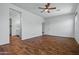 Bedroom with wood flooring and access to both bathroom and closet, convenient and well-designed at 21582 W Cocopah St, Buckeye, AZ 85326