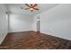 Spacious bedroom with wood flooring, offering a comfortable retreat with easy access to bathroom at 21582 W Cocopah St, Buckeye, AZ 85326