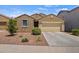 Attractive single-story home with desert landscaping, showcasing its curb appeal and tidy front yard at 21582 W Cocopah St, Buckeye, AZ 85326