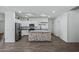 Spacious kitchen with stainless steel appliances, a central island, and ample cabinet space for storage at 21582 W Cocopah St, Buckeye, AZ 85326