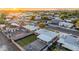 Sunset aerial view of a well-manicured property showcasing the expansive backyard with modern patio furniture at 2225 E Monterosa St, Phoenix, AZ 85016