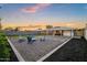Inviting backyard featuring patio with chairs, well-kept lawn, and clear sky at 2225 E Monterosa St, Phoenix, AZ 85016