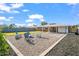 Wide shot of backyard features multiple chairs and a well-kept lawn at 2225 E Monterosa St, Phoenix, AZ 85016