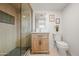 Modern bathroom boasts a glass-enclosed shower and a stylish vanity with marble countertop for an elegant feel at 2225 E Monterosa St, Phoenix, AZ 85016