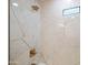 Sleek bathroom featuring large white marble-patterned tile shower with bronze fixtures and modern small window at 2225 E Monterosa St, Phoenix, AZ 85016