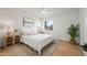 Bright bedroom features a plush white bed, stylish side tables, ceiling fan, and a charming window view at 2225 E Monterosa St, Phoenix, AZ 85016