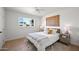 Bright bedroom featuring wood floors, decorative wall art, and a modern ceiling fan at 2225 E Monterosa St, Phoenix, AZ 85016