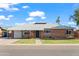 Charming single-story brick home featuring a well-manicured lawn and a classic design at 2225 E Monterosa St, Phoenix, AZ 85016