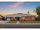 Charming brick home featuring a well-manicured lawn and stylish landscaping, showcasing curb appeal at 2225 E Monterosa St, Phoenix, AZ 85016