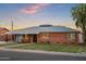 Inviting brick home featuring a neatly kept lawn and classic architectural details at 2225 E Monterosa St, Phoenix, AZ 85016