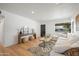 Comfortable living room with a sectional sofa, wood floors, and a view of the exterior at 2225 E Monterosa St, Phoenix, AZ 85016