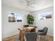 Bright office space featuring wood desk, two chairs, and natural light at 2225 E Monterosa St, Phoenix, AZ 85016