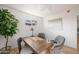Cozy office space with wood desk, two chairs, and natural light at 2225 E Monterosa St, Phoenix, AZ 85016
