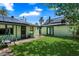 Spacious backyard with green grass, mature trees, shade and patio at 2230 N 12Th St # Rear, Phoenix, AZ 85006