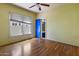 Bedroom with wood floors, natural light and an ensuite bathroom at 2230 N 12Th St # Rear, Phoenix, AZ 85006