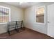 Bedroom with carpet, windows, and a door leading to another room at 2230 N 12Th St # Rear, Phoenix, AZ 85006