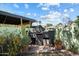 A built-in outdoor grill area with desert landscaping offers a unique entertaining space at 2230 N 12Th St # Rear, Phoenix, AZ 85006