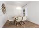 Dining room features a glass-top table with six chairs and modern chandelier at 22756 N 91St Way, Scottsdale, AZ 85255