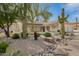 Stunning single-story home featuring desert landscaping with mature Saguaro cacti and a charming pergola-covered entry at 22756 N 91St Way, Scottsdale, AZ 85255