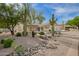 Front exterior of a home featuring desert landscaping and cacti at 22756 N 91St Way, Scottsdale, AZ 85255