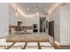 Modern kitchen featuring a stone breakfast bar, stainless steel appliances, and ample white cabinets at 22756 N 91St Way, Scottsdale, AZ 85255