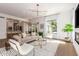 Inviting living room features open layout, modern lighting, and seamless transition to the dining area and gourmet kitchen at 22756 N 91St Way, Scottsdale, AZ 85255