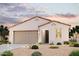 Charming single-story home with neutral colors, a tile roof, and a two-car garage at 22798 N 182Nd Ln, Surprise, AZ 85387